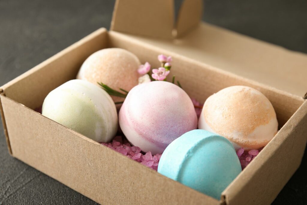 colorful homemade bath bombs placed in a box