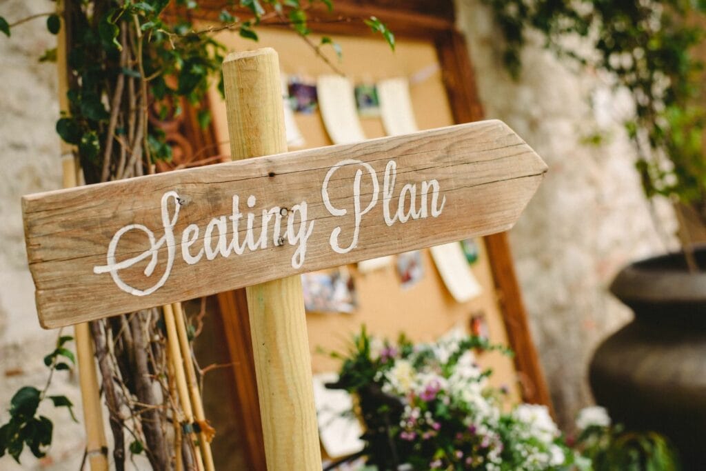 a handmade wedding seating chart sign